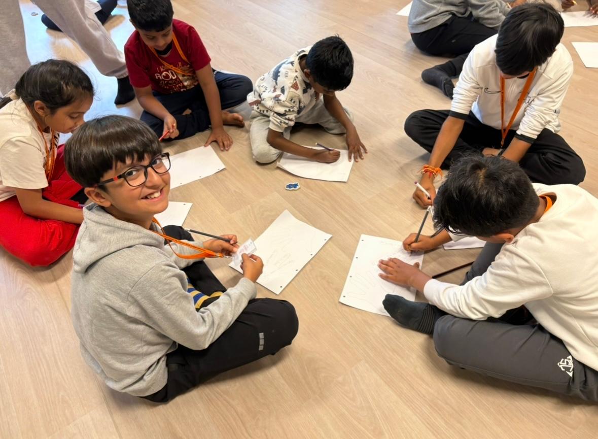 Children taking part in a creative group activity